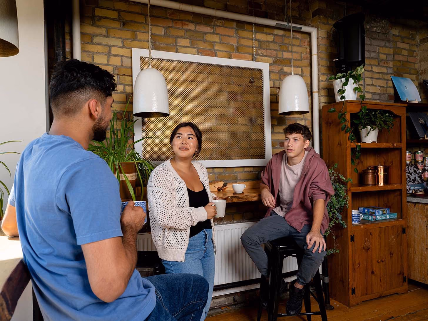 Participants sitting around a coffeee shop chatting