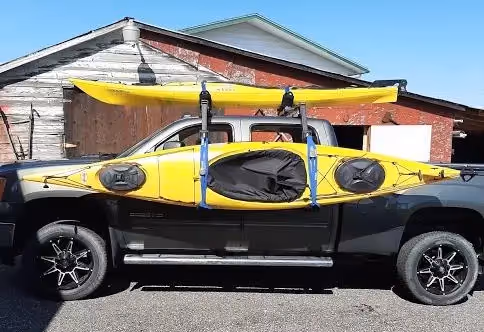 Two Hullavator Pro kayak racks on the truck