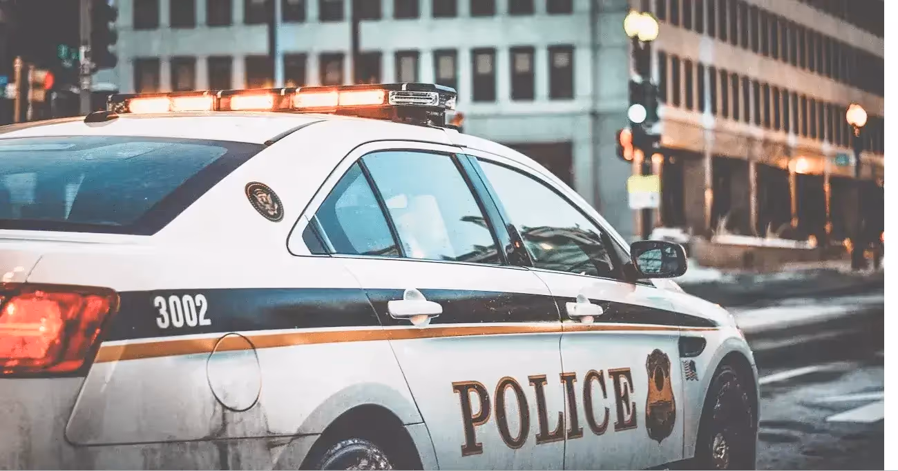 police car driving in the city