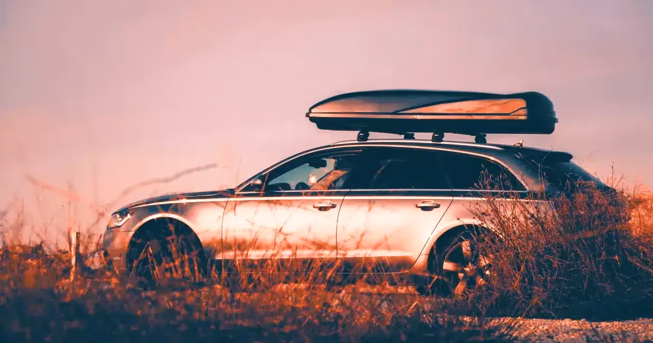 vehicle with roof racks and thule cargo box