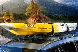 yellow canoe mounted to horizontal saddle roof rack