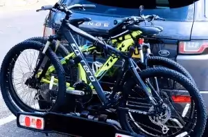 two mountain bikes secured to hitch rack