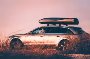 vehicle with roof racks and thule cargo box