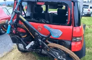 car with broken glass from bike rack