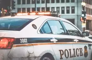 police car driving in the city