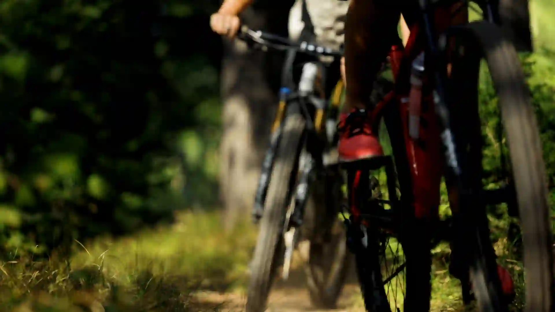 Close-up cinematic shots of mountain bikes on Casper Mountain during a Checked In Media video production advertisement for Hilltop Bank in Casper, Wyoming, with local ad agency support.