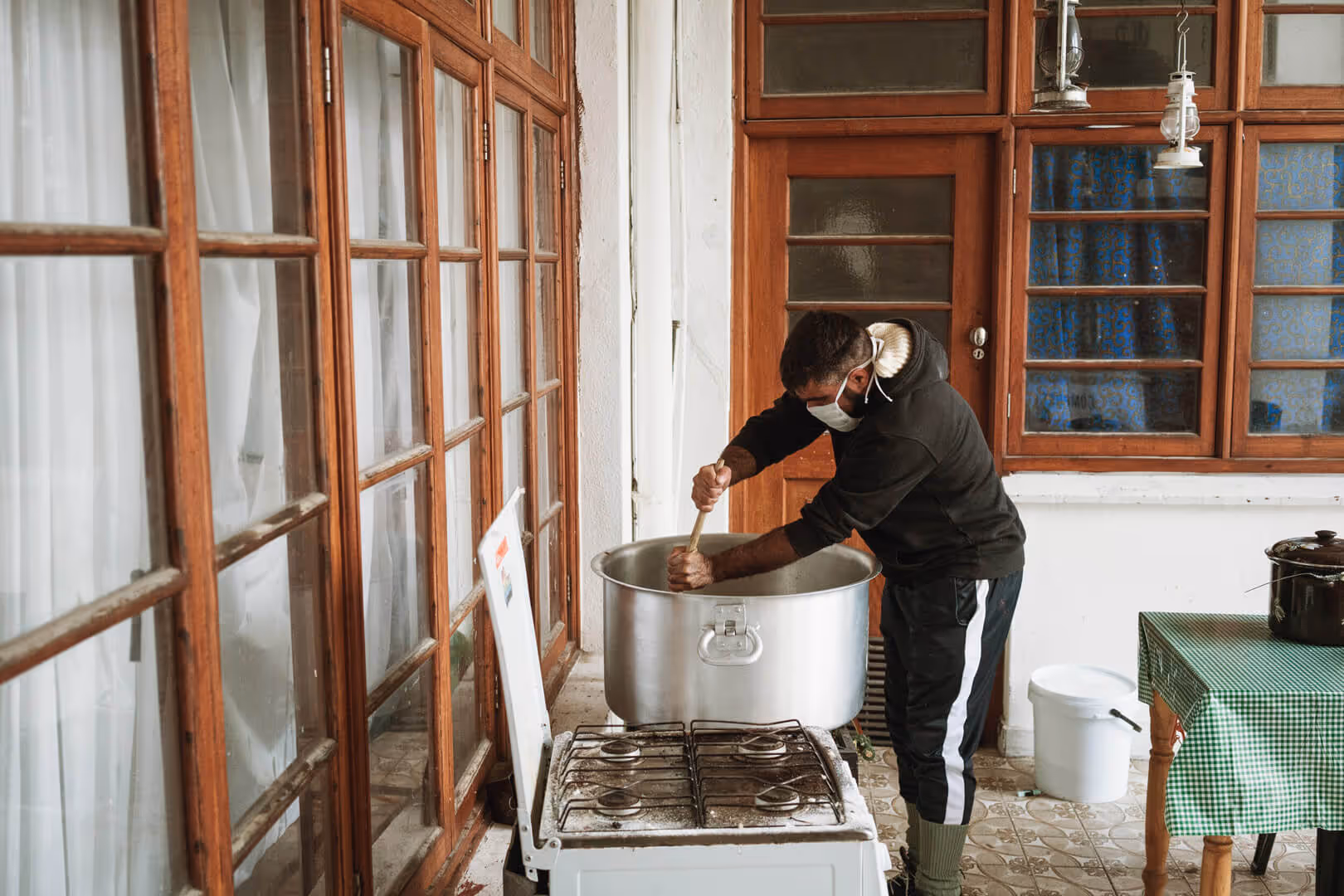 A resident of our New Hope SA house prepares food for the community.
