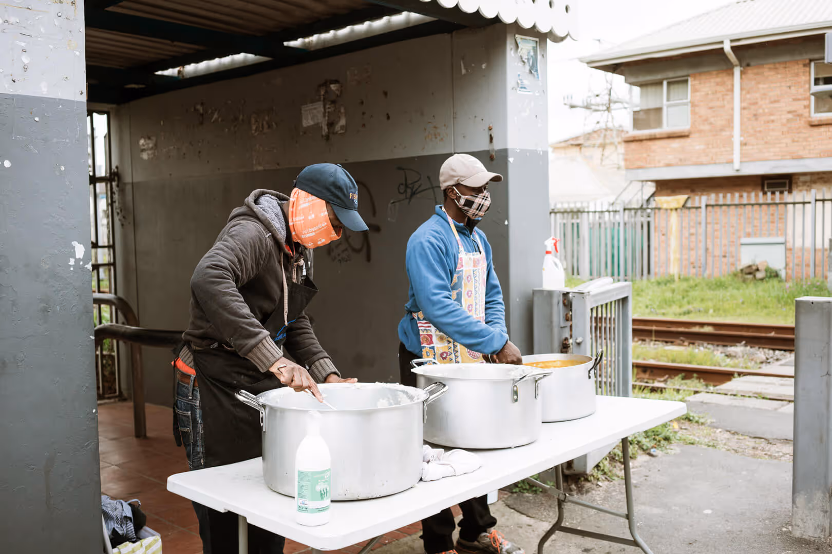 Residents distribute food to the New Hope SA community.