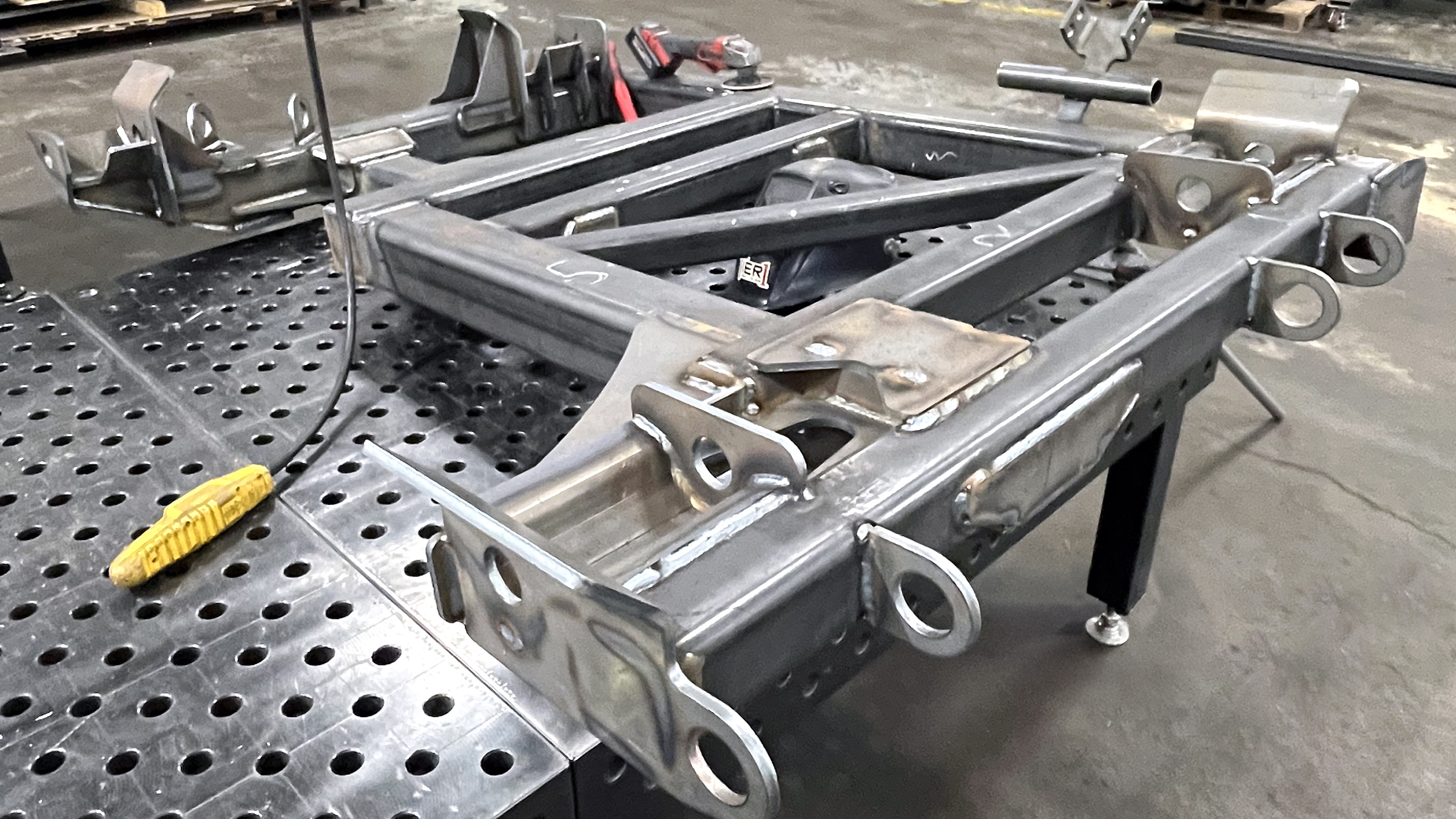 Diesel mechanic performing welding service on semi truck in Holland, MI