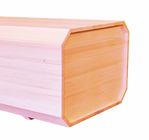 Close-up of an octagonal wooden box with smooth light wood panels.