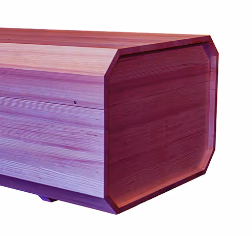 Close-up of a purple-toned wooden coffin with an octagonal shape and a smooth finish.