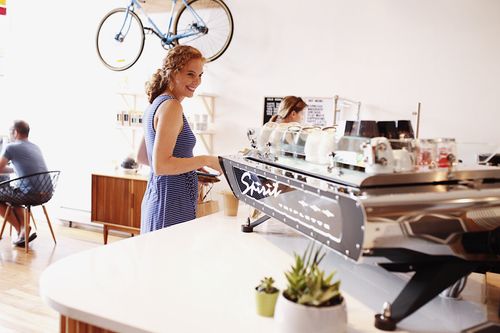 Woman ordering coffee at a specialty cafe