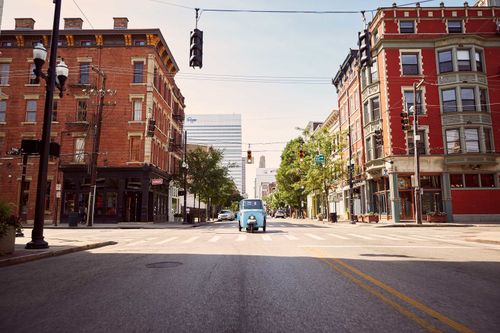Italian Vespa street car driving down city streets