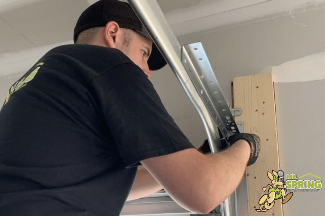 Professional Garage Door Technician Repairing Tracks