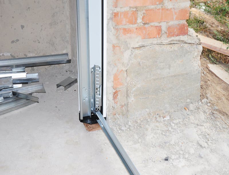 Close Up on Installing Garage Door. Garage Door. Stock Image