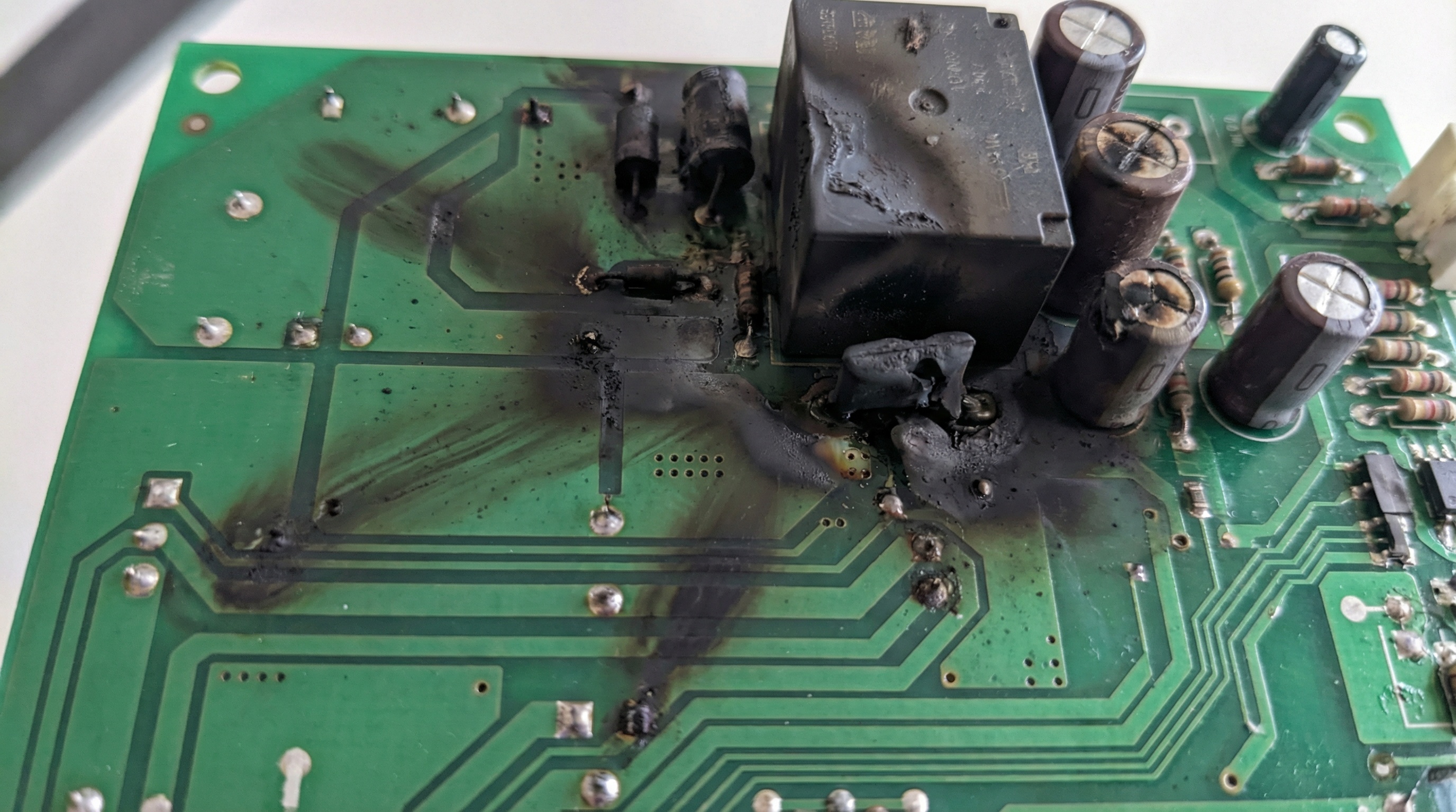 Garage door circuit board with burn damage