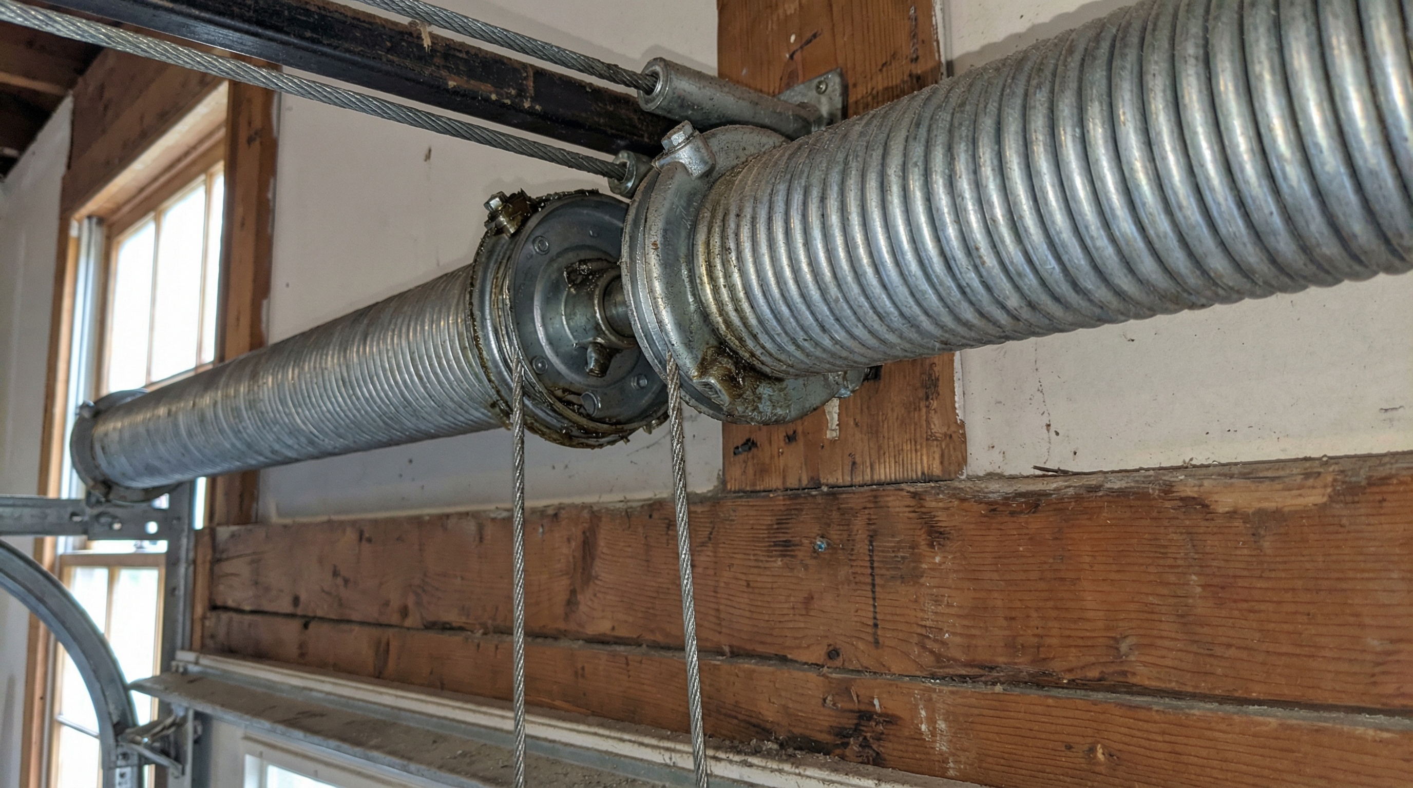 close-up of garage door springs and hardware components