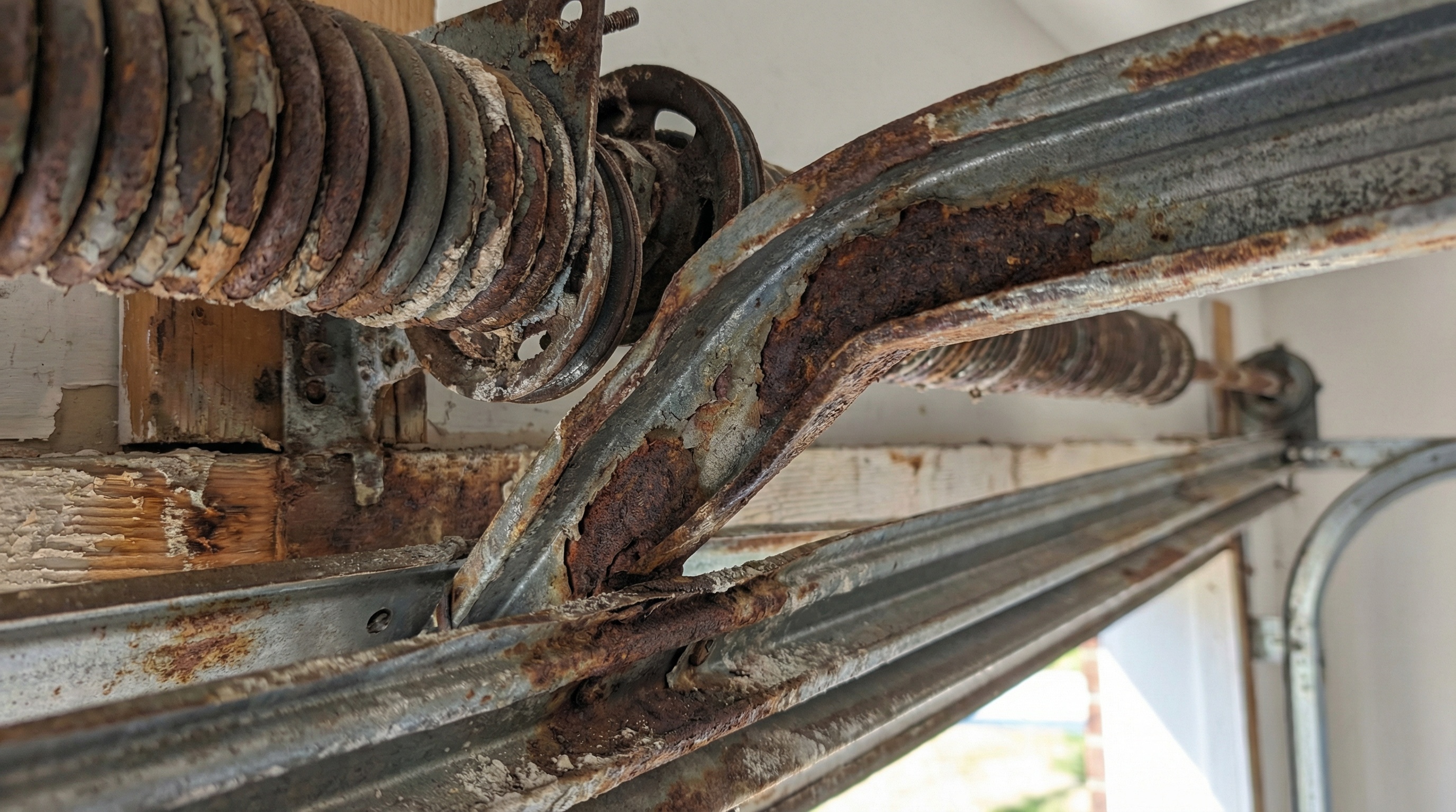 Garage door components damaged by heat and humidity