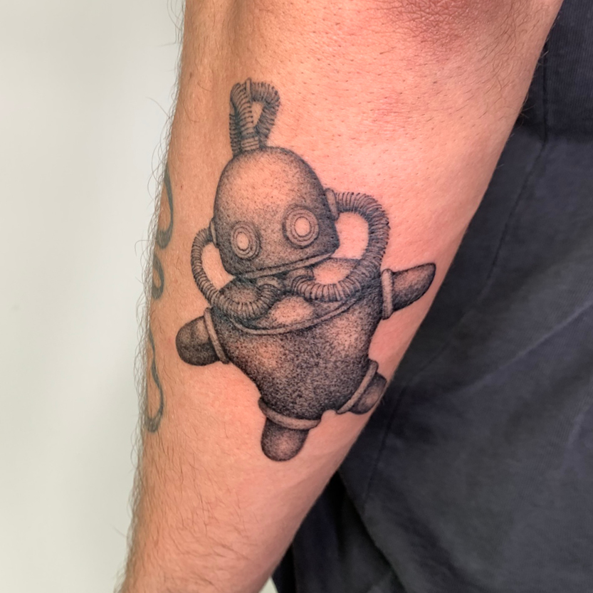 Een foto van een tattoo op een arm