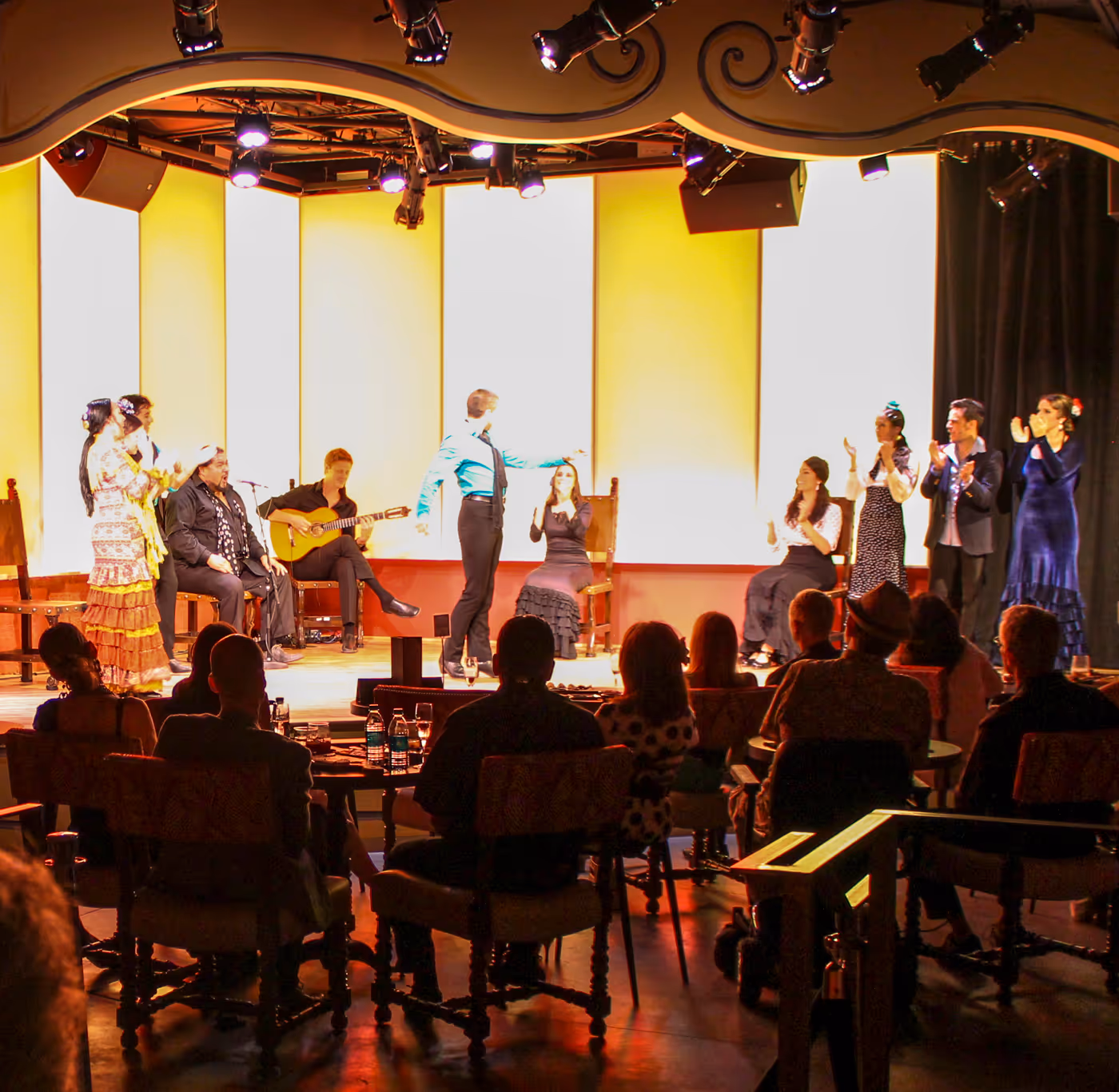 Tablao Flamenco performance space with performers on stage and an audience