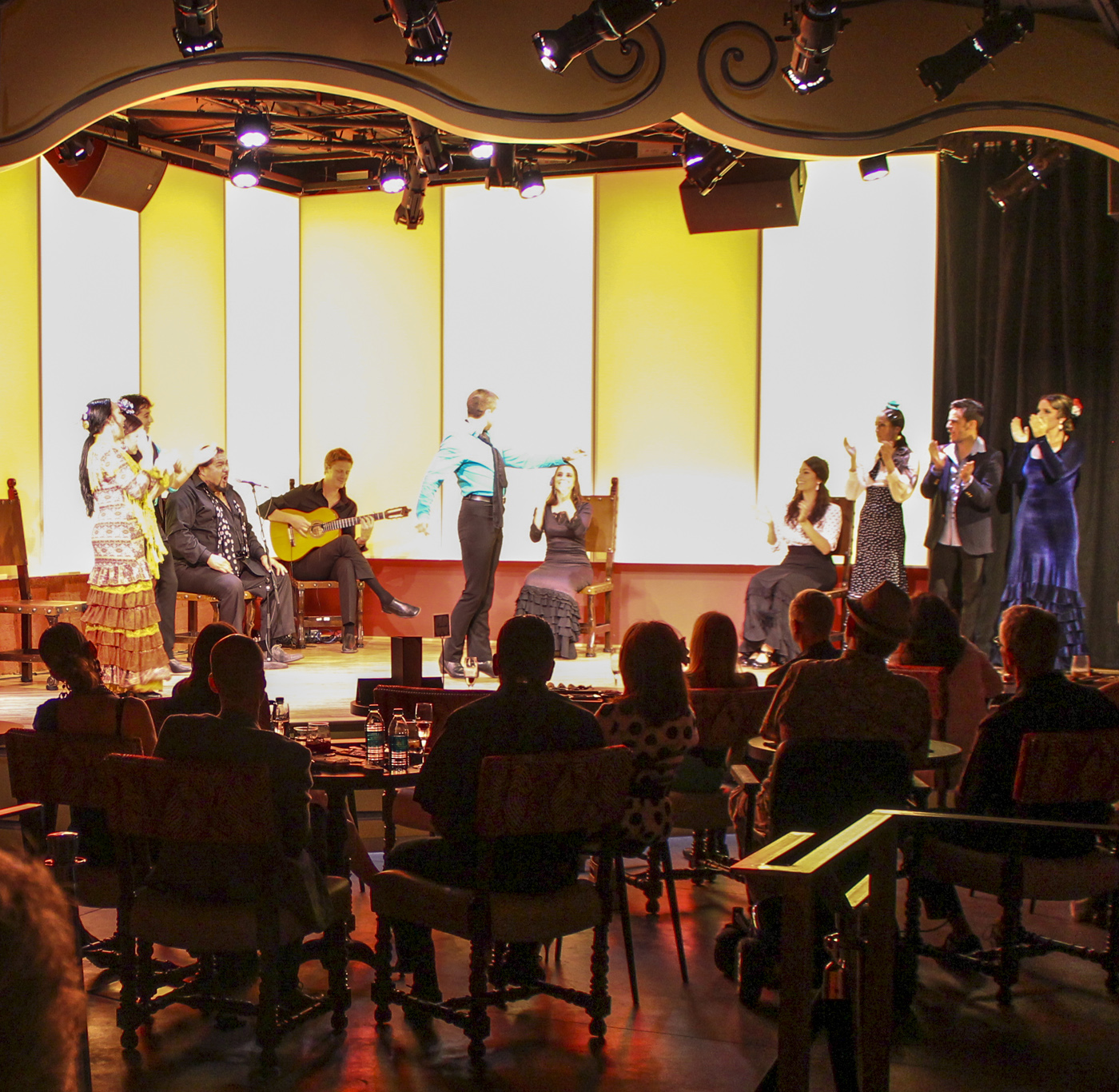 Tablao Flamenco performance space with performers on stage and an audience