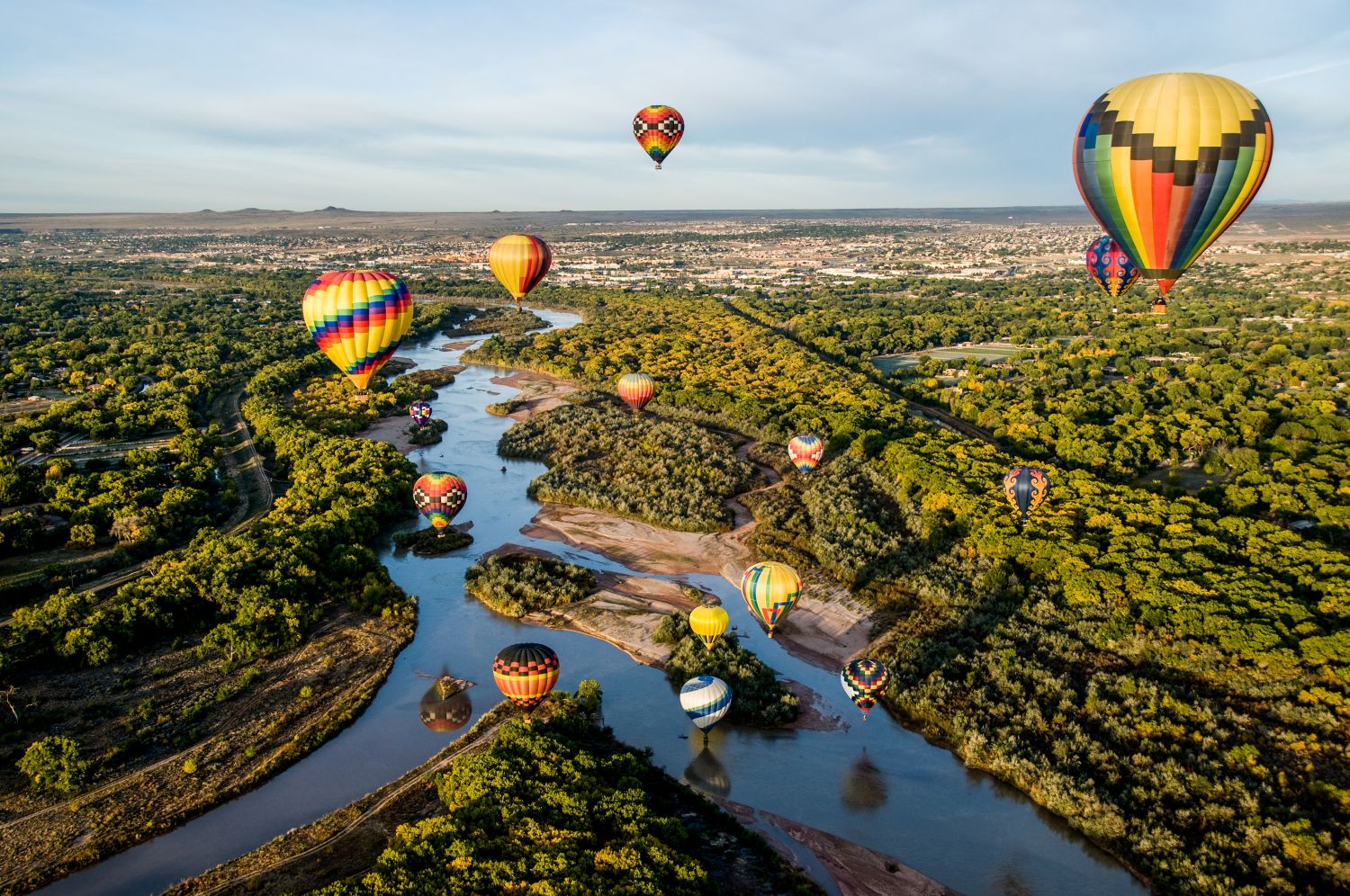 Hot air balloons in flight over the Rio Grande