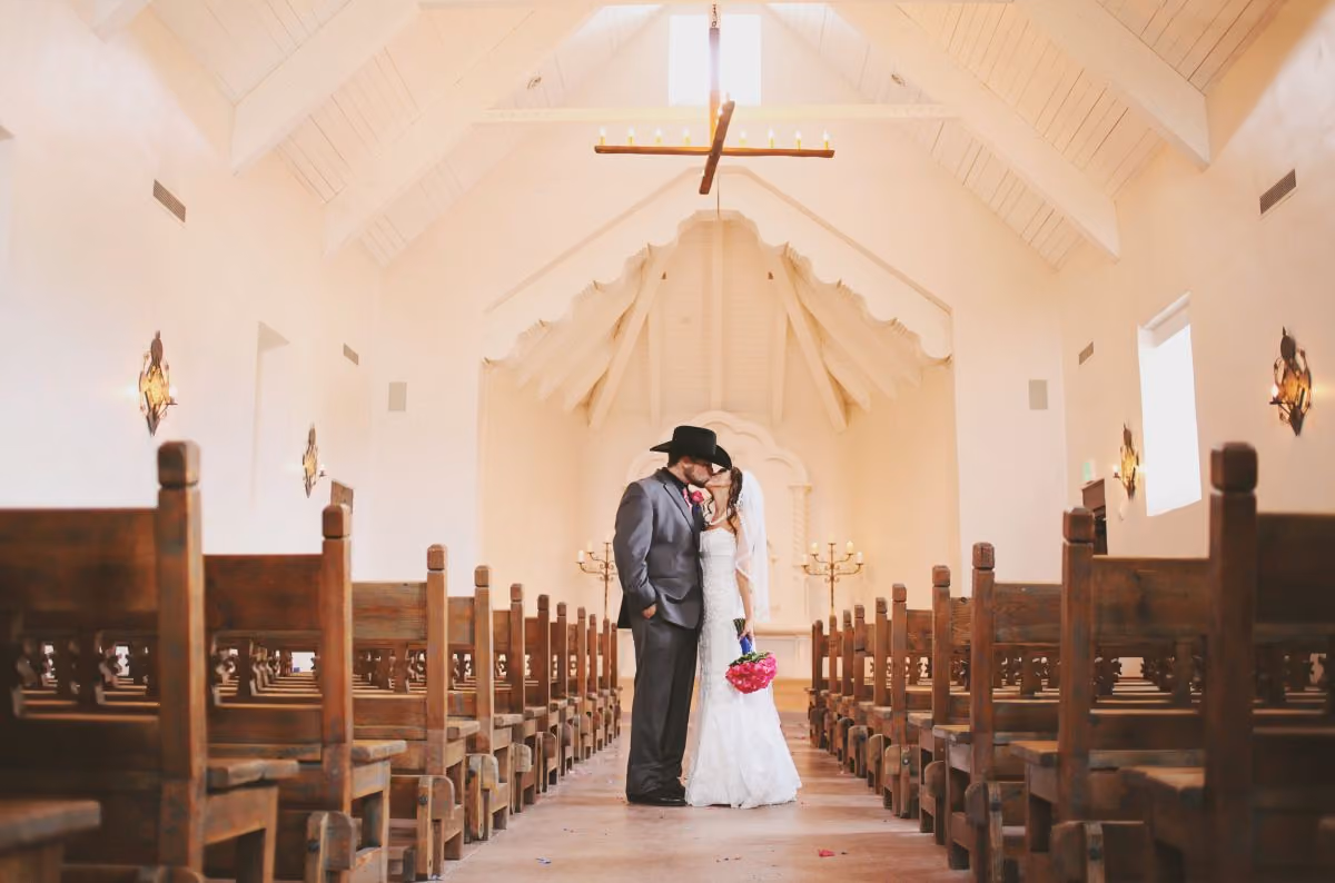 Bride and Groom inside the romantic San Isidro de Capilla wedding chapel