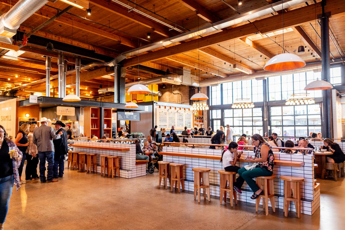Interior of Sawmill's main dining area with people sitting and dining