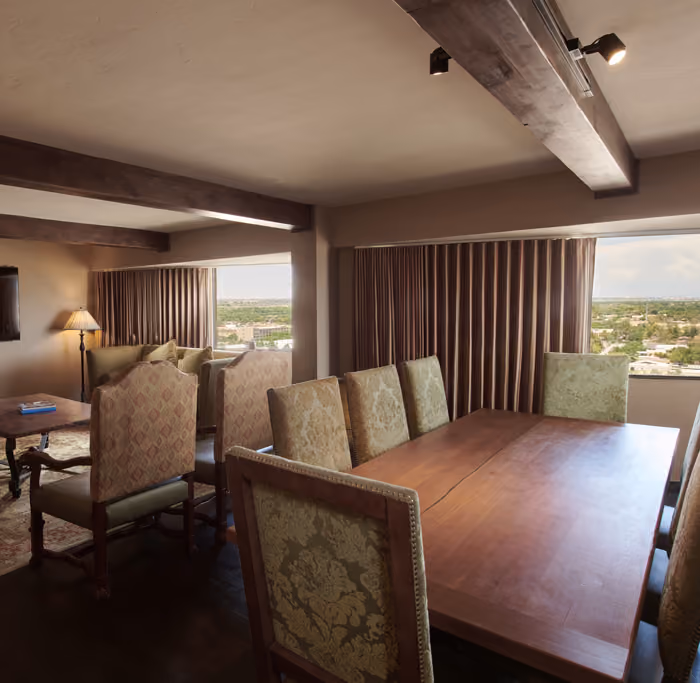 Presidential Suite living room with dining table and additional 