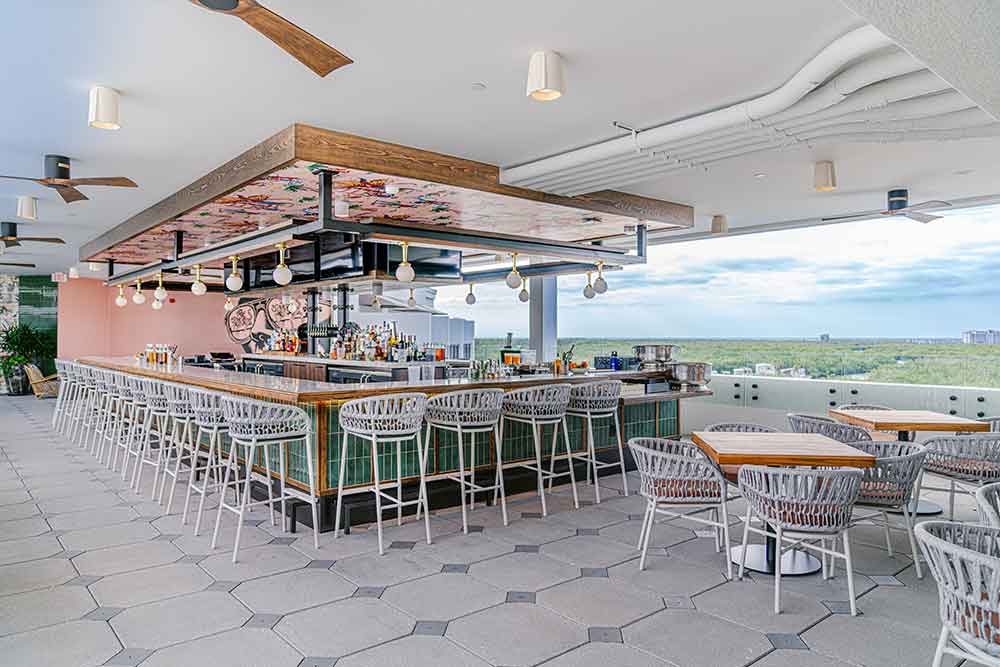 Rooftop bar with scenic views and modern seating.