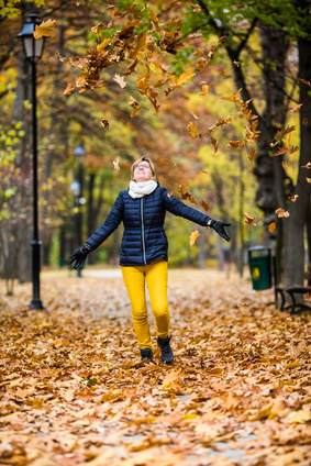 Middle-aged woman walking in city park