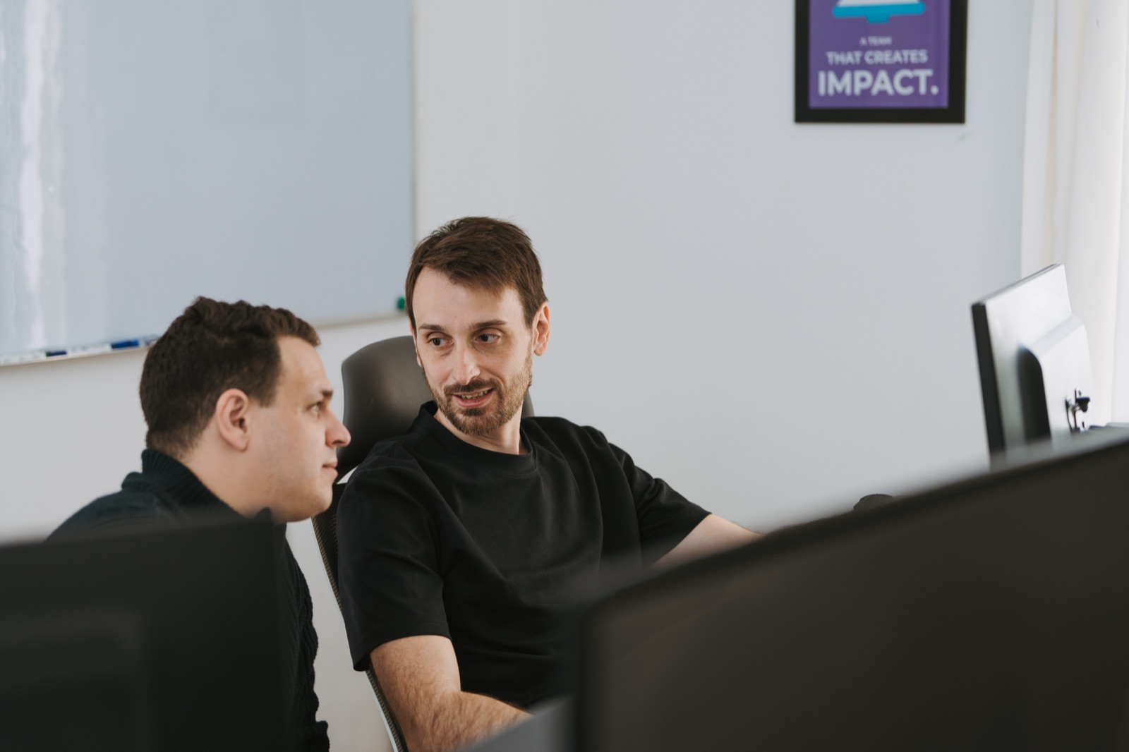 Team reviewing AI evaluation results on a screen