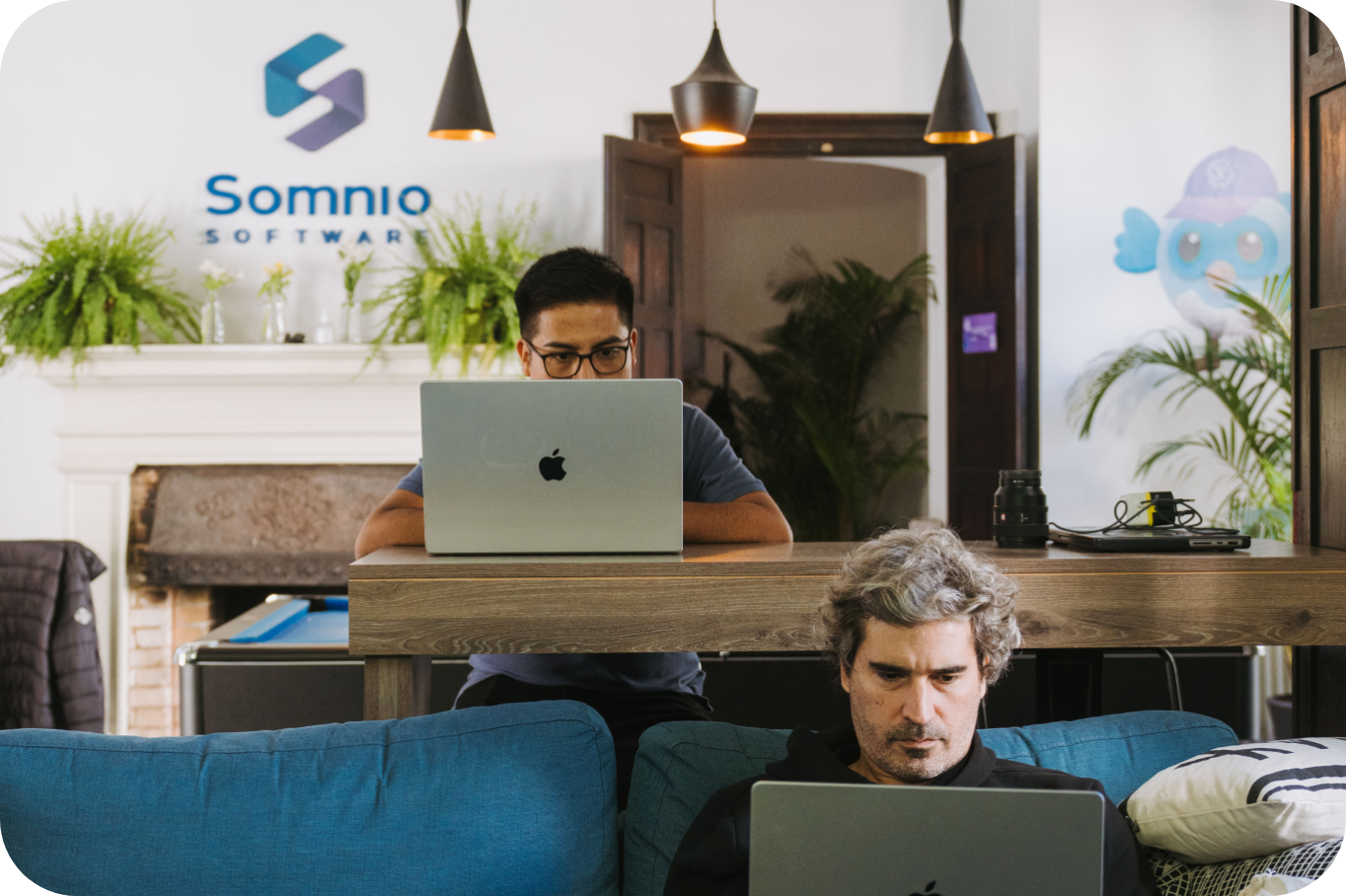 Somnio engineers working on laptops at the office lounge
