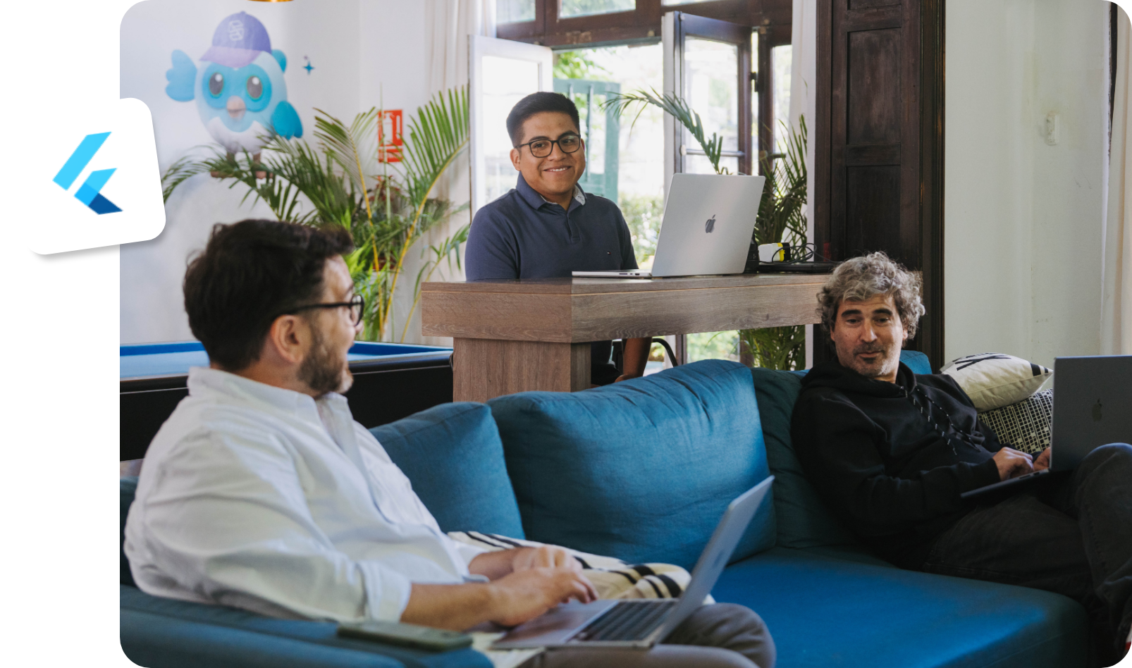 Somnio team working at the office lounge, with the Flutter logo