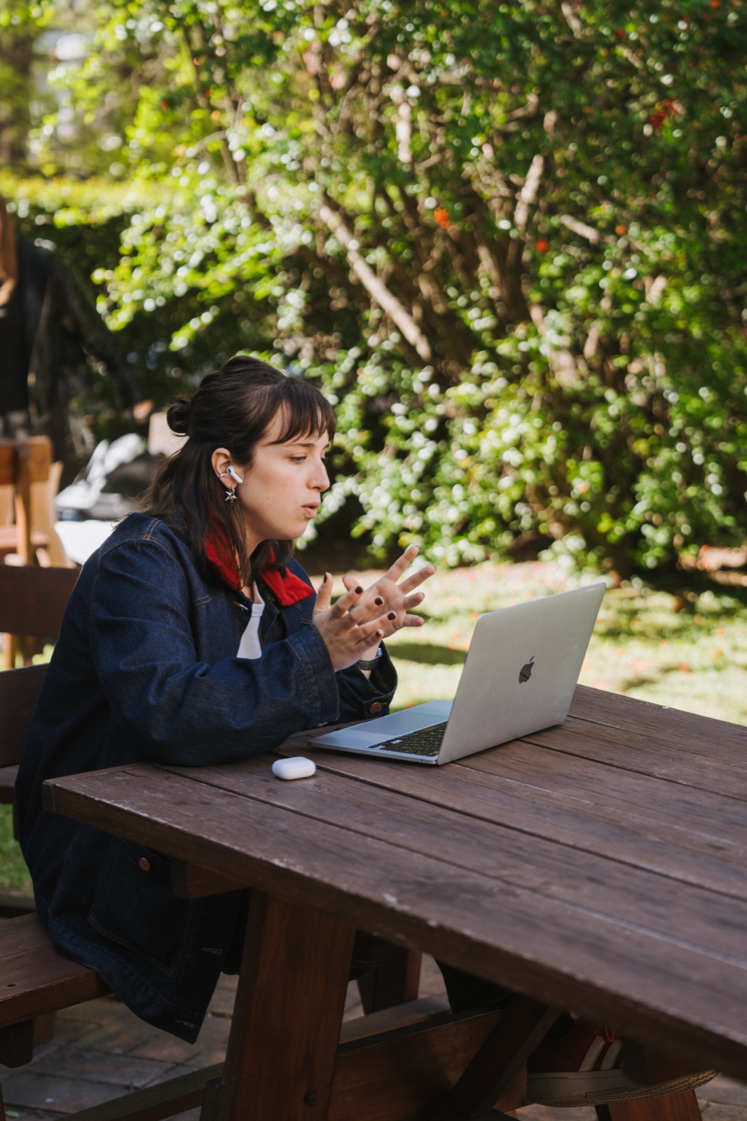 Somnio engineer on a video call with a laptop at an outdoor table
