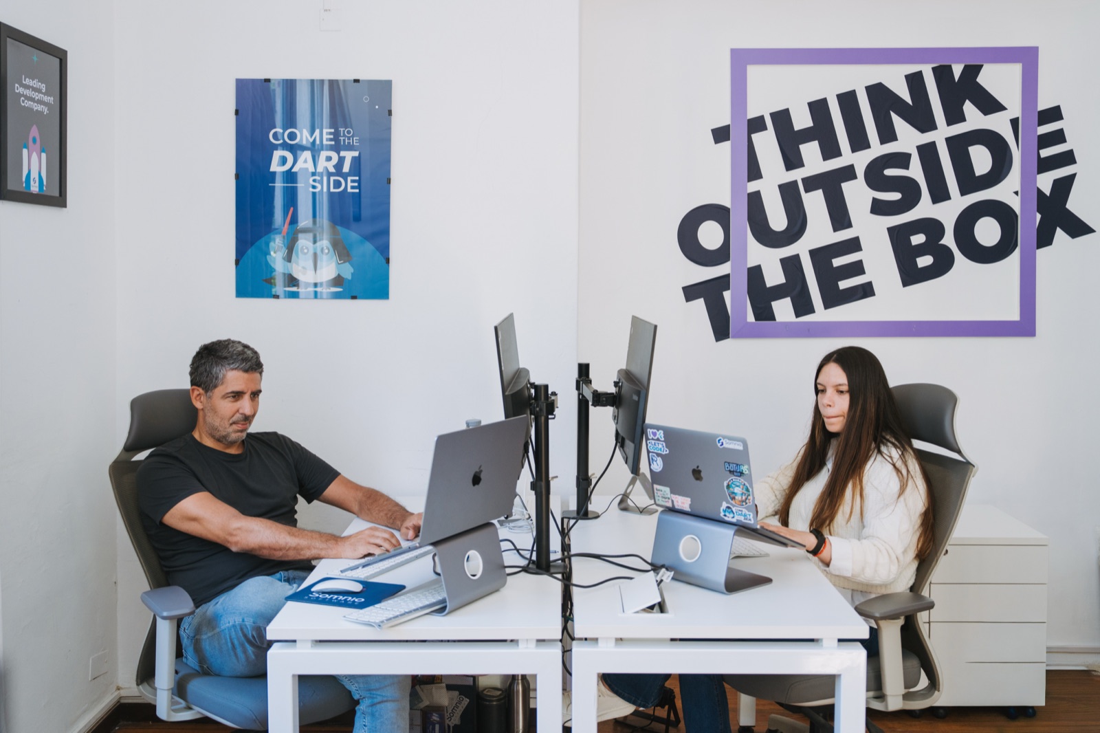 Two Somnio engineers working at their desks in the office