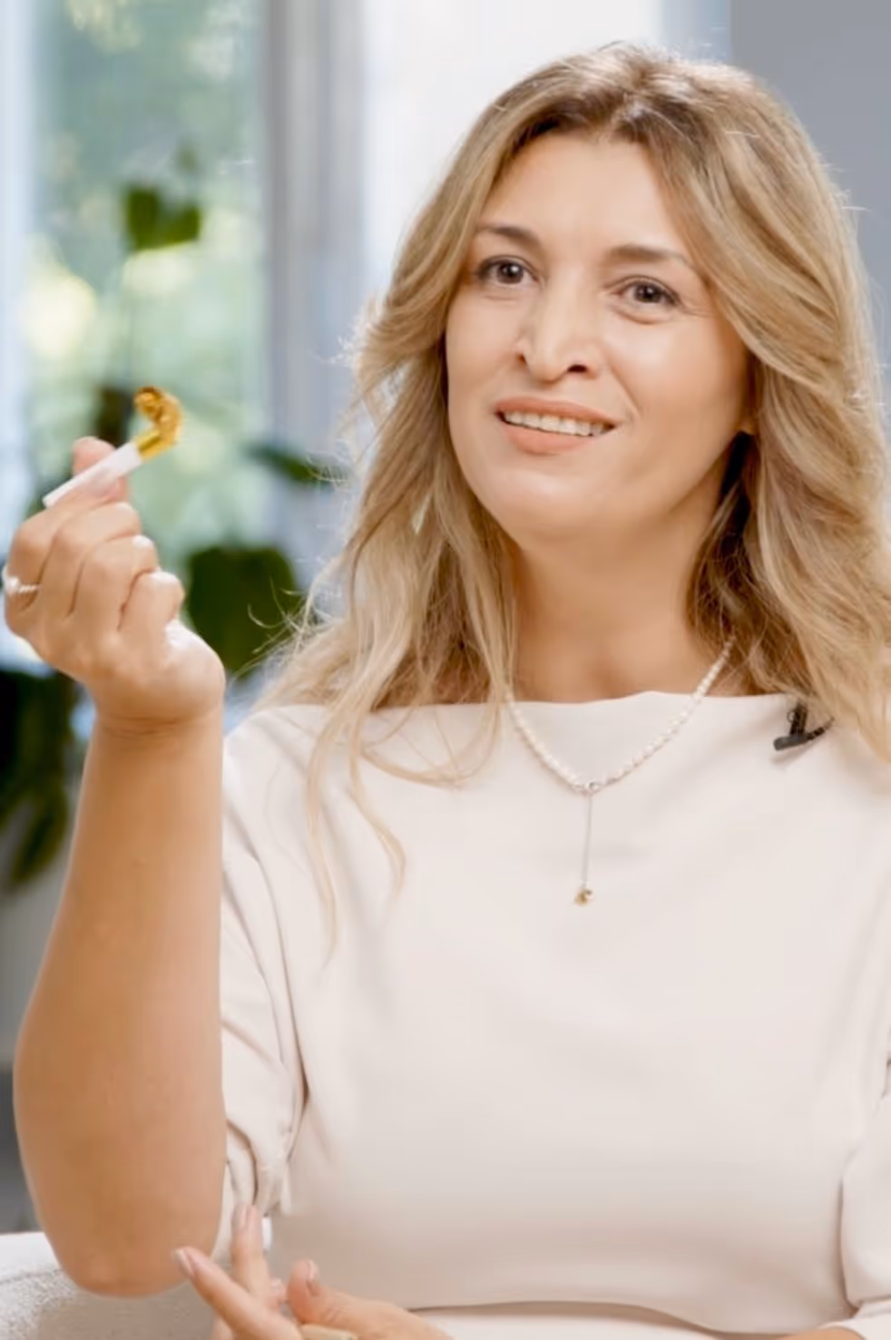 a woman holding a cigarette