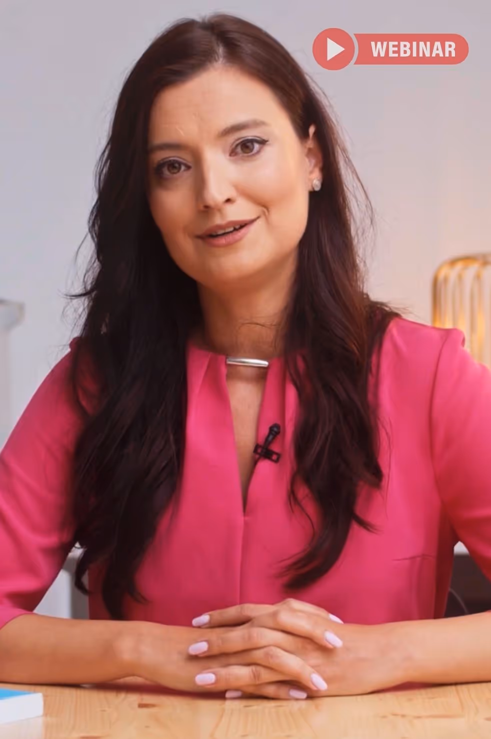 a woman in a pink shirt