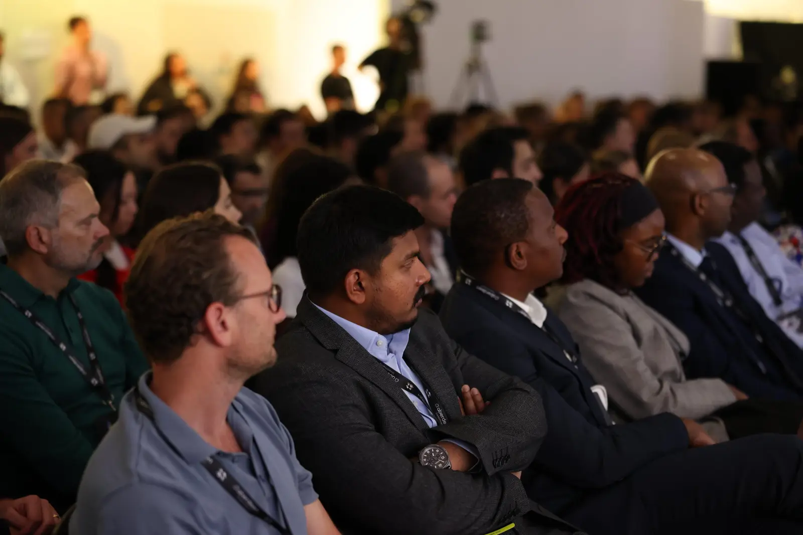 Attendees listening closely during a session