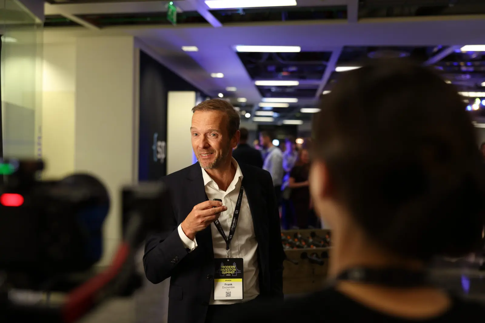A speaker being interviewed on camera
