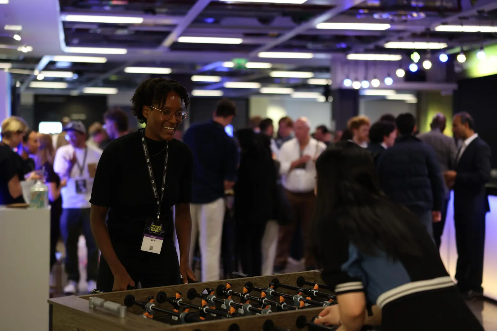 Attendees playing table football
