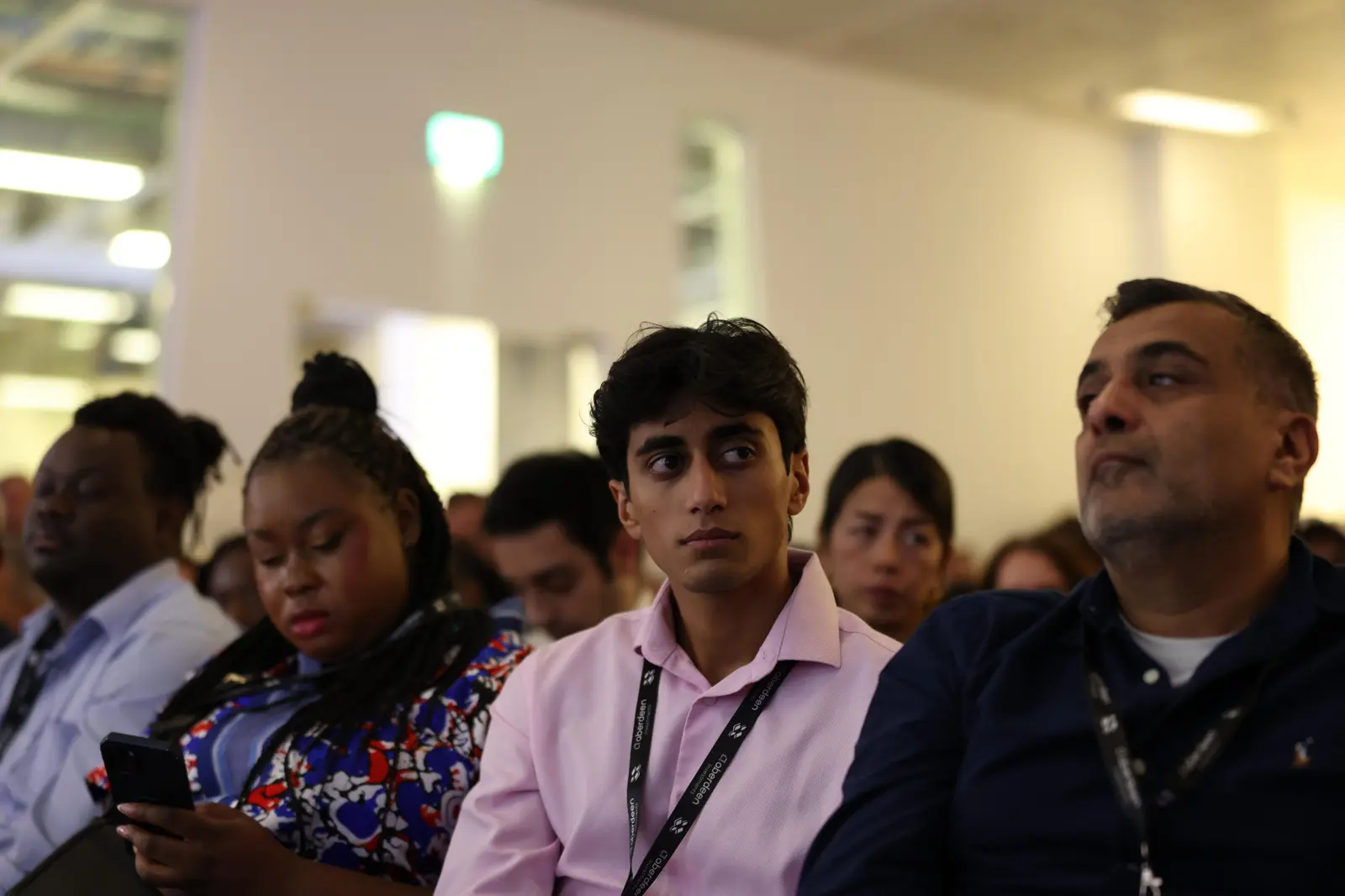 Attendees in the audience during a session