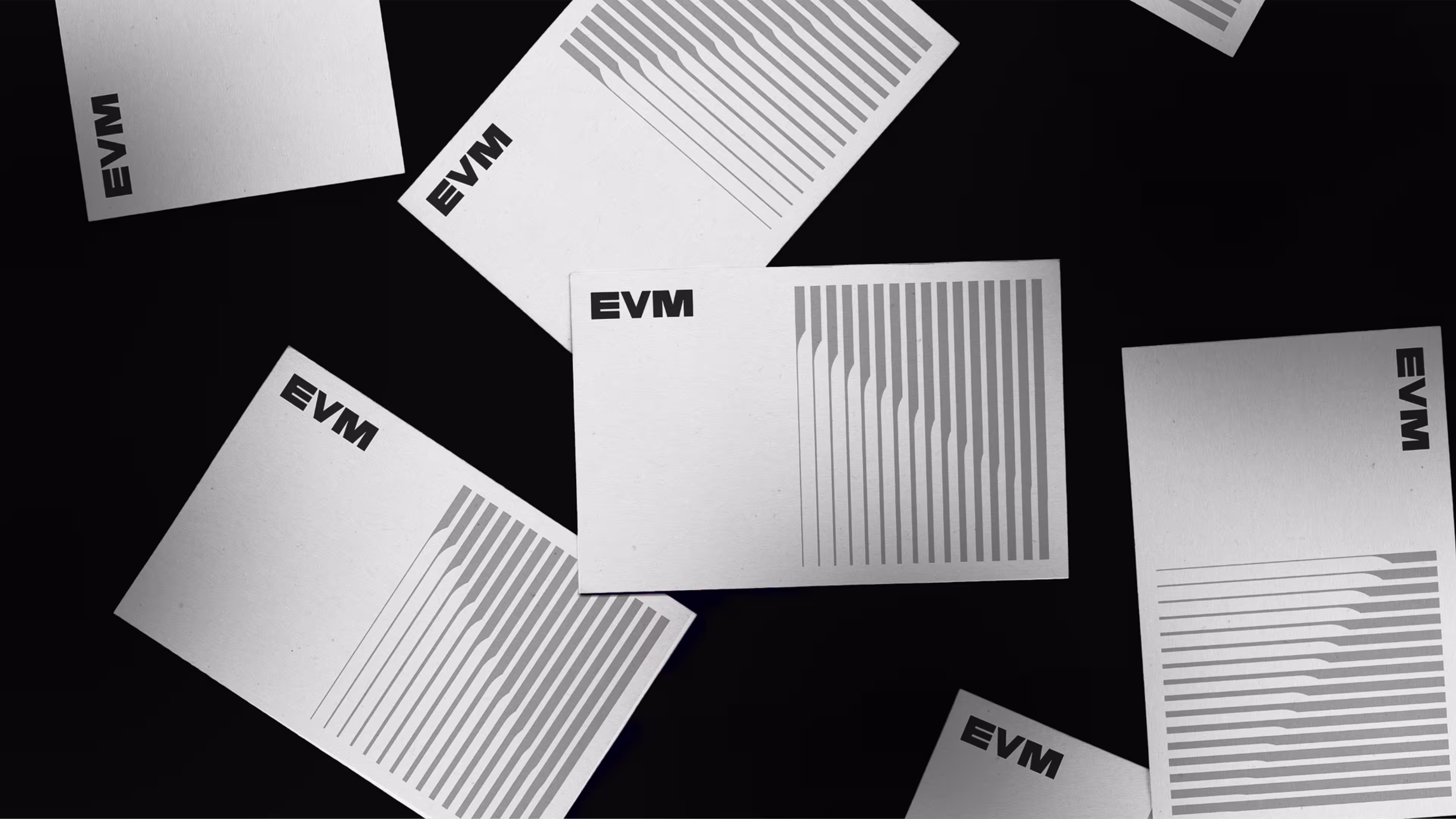 White cards with the text EVM and vertical gray bars scattered on a black background.