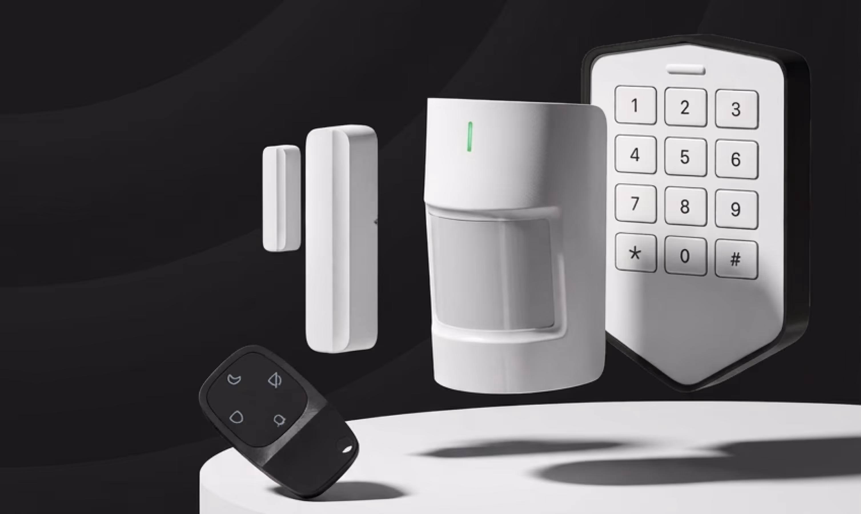 Home security system components including keypad, motion detector, door sensors, and remote control.