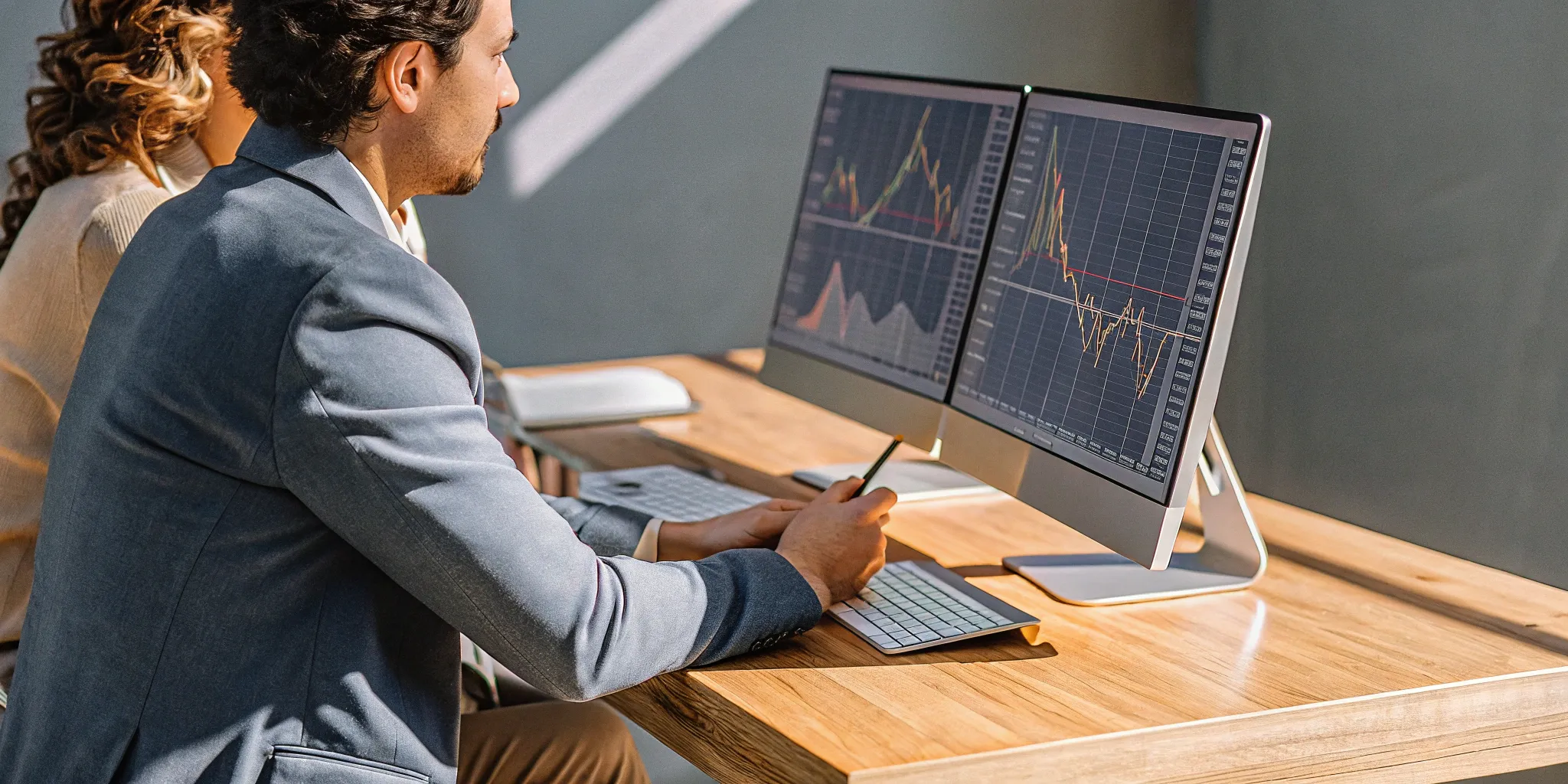 Real-time accounting benefits: Financial data analysis on dual monitors.