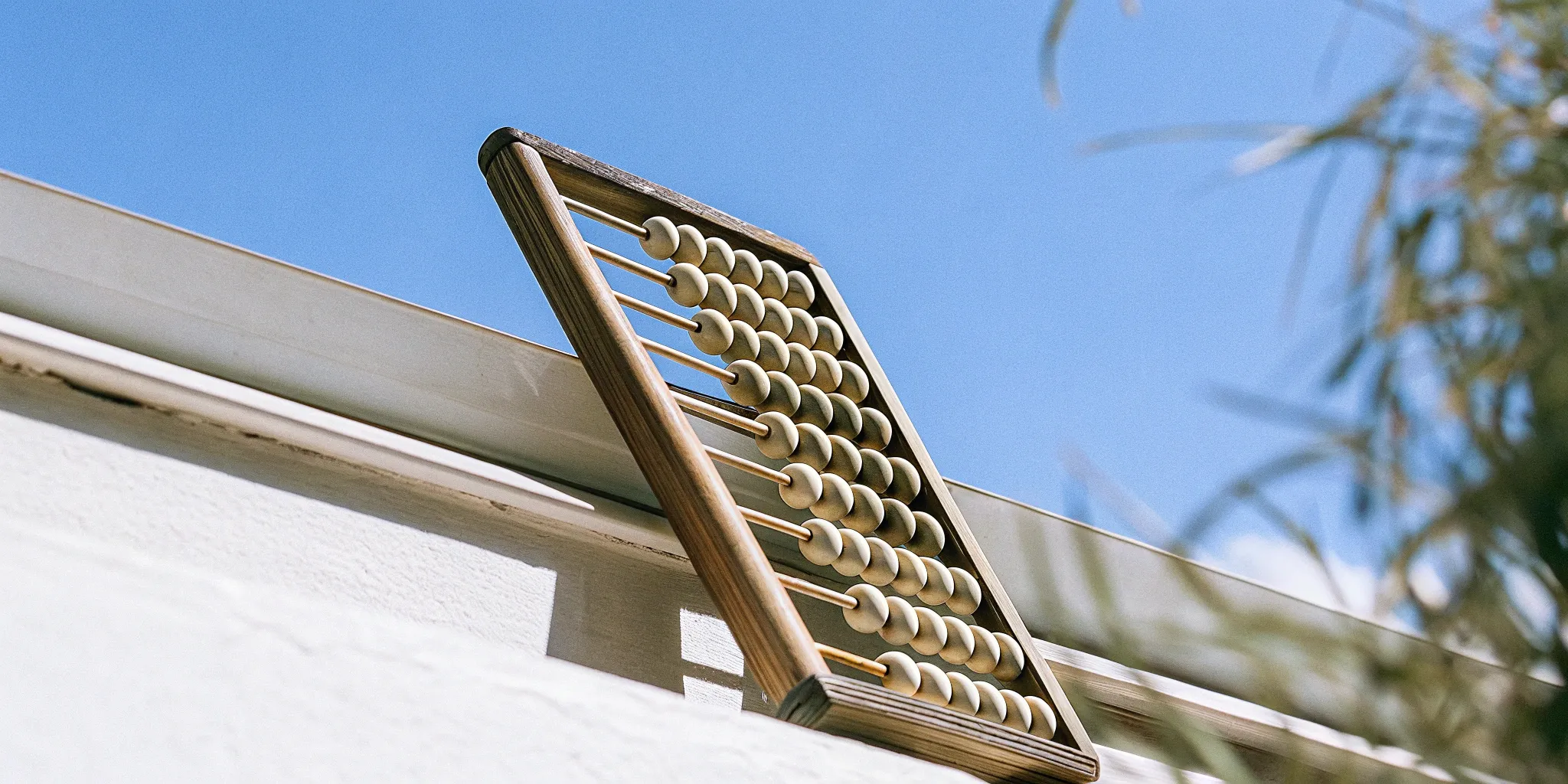 Abacus representing acquisition cost amortization.