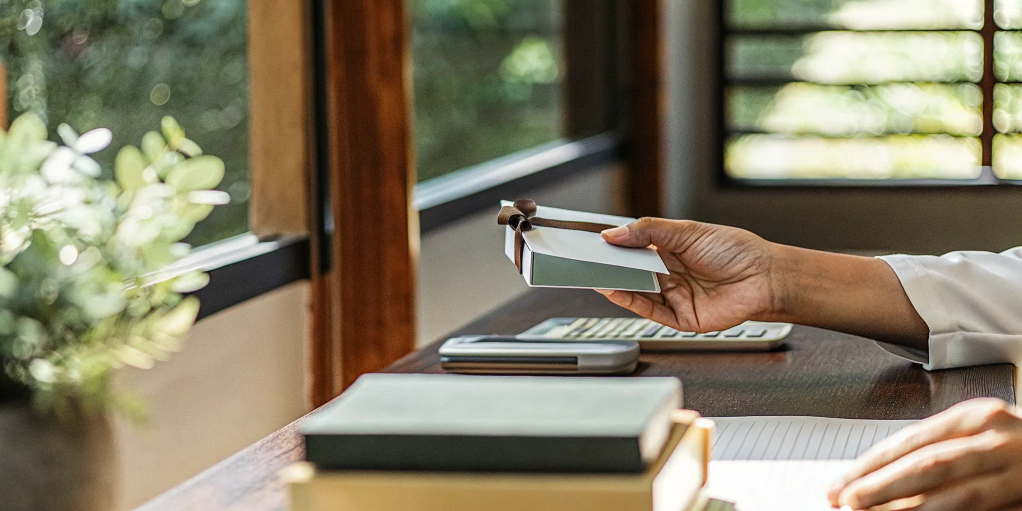 Gift card with ribbon on desk.