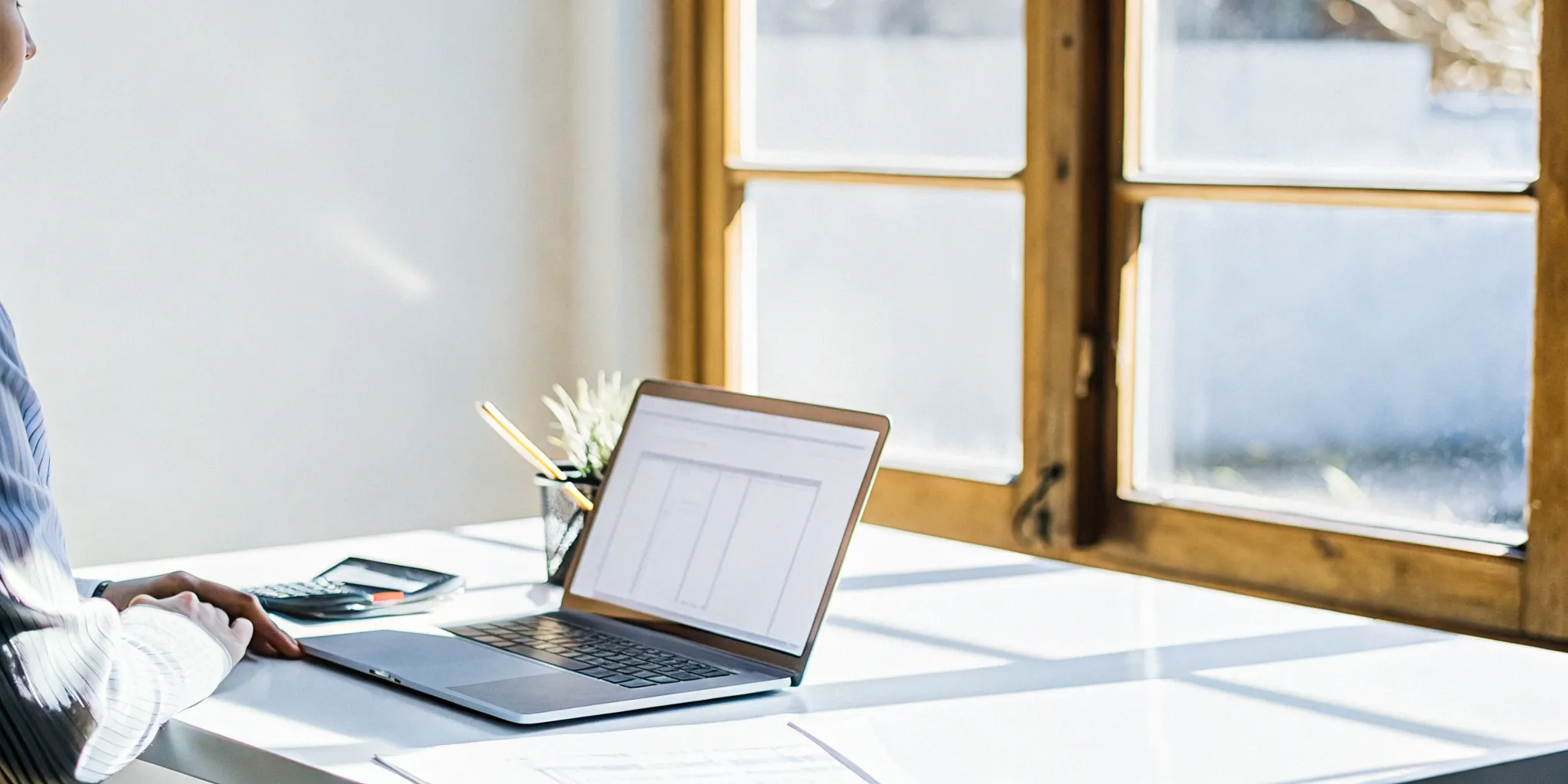 Revenue reporting tools on a bright office desk.