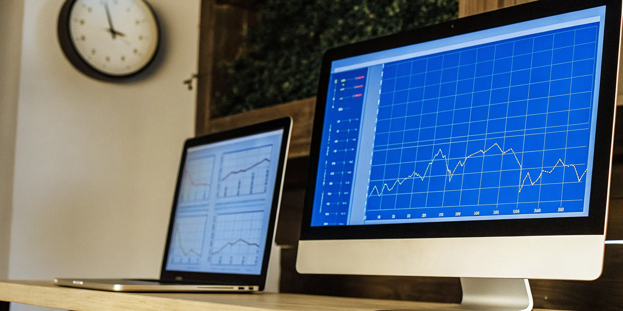 Financial data displayed on dual monitors for continuous close process.