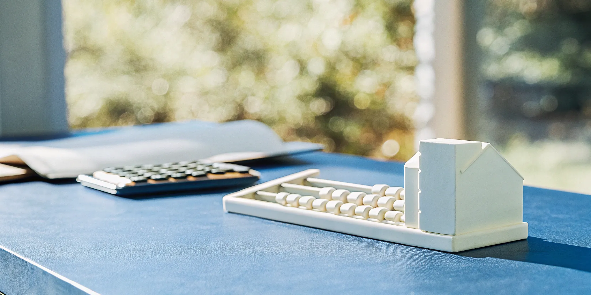 Order to cash journal entries: Abacus and calculator.